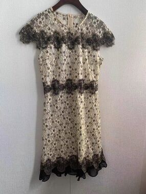 Elegant Cream Lace Dress with Black Floral Trim